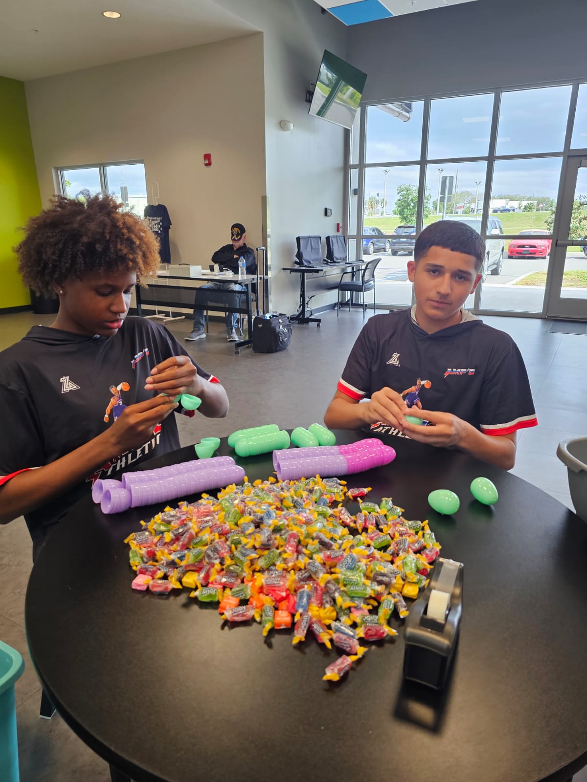 AMPD players filling eggs with candy for the community Easter Egg Hunt