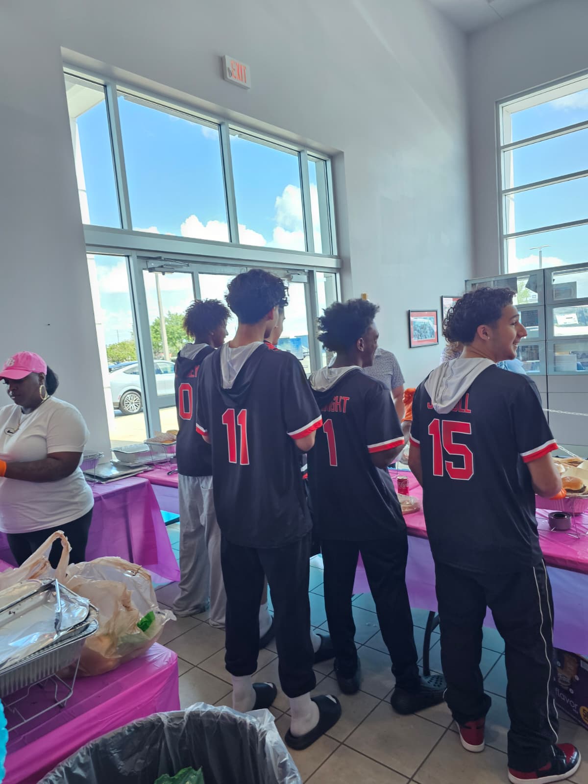 AMPD players serving food at the Jarrett Gordon Ford dealership fundraiser